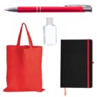 A red pen, a clear bottle of hand sanitizer, an orange tote bag, and a black notebook with a red accent, all arranged neatly on a white background.