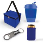 A collection of blue promotional items on a white background, including a zippered cooler bag with a black strap, a reusable travel cup with a lid, a bottle opener keychain, and a can cooler holding a beverage can.