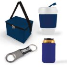 A collection of blue and silver items: an insulated lunch bag with a black strap, a travel mug with a lid, a bottle opener keychain with a black loop, and a can holder with a canned drink inside.