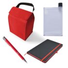 A collection of items including a red insulated lunch bag with a black handle, a slim transparent water bottle with a black cap, a red and silver pen, and a black notebook with a red elastic band.