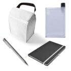 White lunch bag with black handle, transparent flat water bottle, silver pen, and black notebook with white elastic band on white background.
