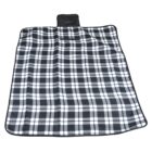 A black and white plaid blanket is laid out flat, featuring a checkered pattern. The blanket has a handle or strap attached, indicating it is designed for easy carrying or storage.