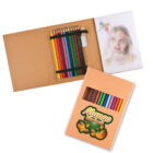 An open cardboard art set displays colored pencils, eraser, and sharpener, with a sketch of a girl and a bird. Below, a closed box features a Mango Madness logo and a window showing pencils inside.