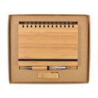 A bamboo-themed stationery set in a brown cardboard box, featuring a spiral-bound notebook with a black elastic band, a silver and black pen, and a small rectangular USB flash drive.