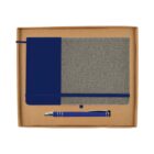 A boxed gift set containing a fabric-covered notebook with a blue spine and a matching blue pen. The notebook has an elastic band for closure and a ribbon bookmark. The set is presented in a simple brown cardboard box.