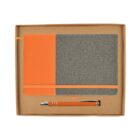 A boxed stationery set containing an orange and gray notebook and an orange and silver pen. The notebook features a strap and a ribbon bookmark. Both items are presented in a simple cardboard box.