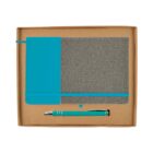 A notebook and pen set in a cardboard box. The notebook has a gray fabric cover with a turquoise section and elastic band. The pen is silver with turquoise accents, matching the notebook.