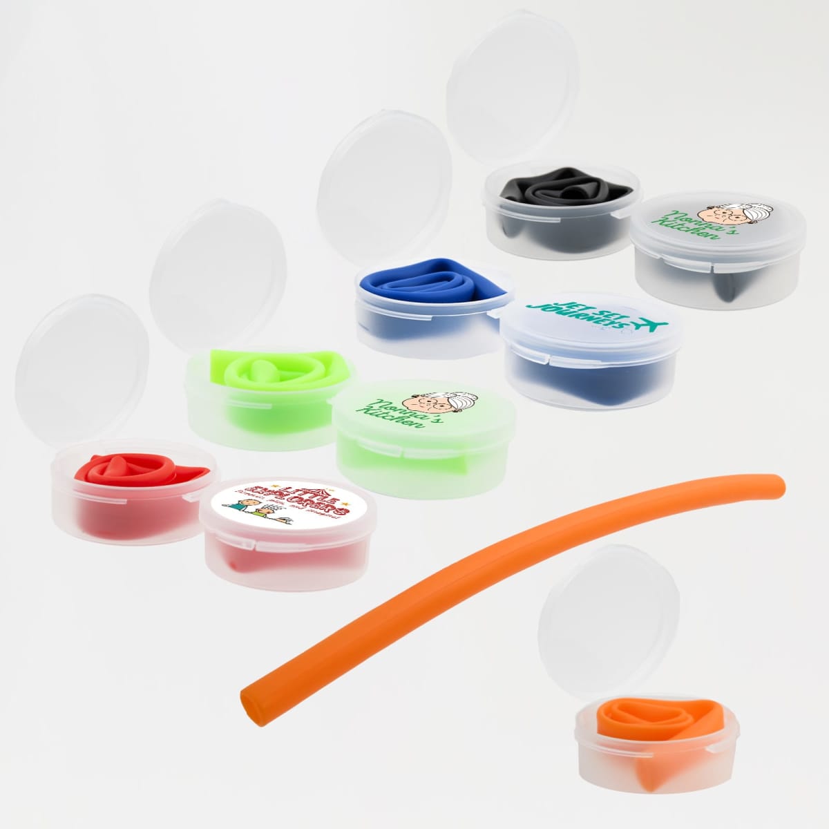 Various colored earplugs with transparent cases are displayed. The earplugs are in shades of green, orange, black, pink, red, and blue, with one long orange earplug stretched out. The cases have different logos on the lids.