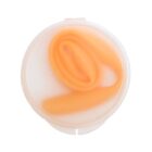 Top view of a translucent circular container with a coiled orange object inside. The container has a frosted appearance, showcasing the soft hue of the contents.