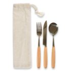 A set of cutlery featuring a fork, knife, and spoon with wooden handles, displayed alongside a cream-colored cloth pouch with a drawstring.
