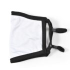 A white face mask with black edges and adjustable ear loops lies flat. The mask has two black stoppers for securing the ear loops and a clean, minimalist design on a white background.