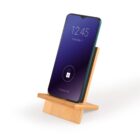 Smartphone with a dark blue lock screen displaying 12:45, Friday, May 11, on a wooden stand against a white background. The lock icon is visible on the screen.