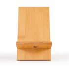 A wooden smartphone stand made from bamboo, featuring a simple design. It has a flat backrest and a horizontal support ledge with a circular cutout at the bottom for cable management. The stand is shown on a white background.