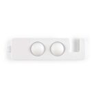 A white, rectangular plastic object with two domed circular sections and a cut-out U-shape on one end. It has a small loop on one corner for hanging or attachment.