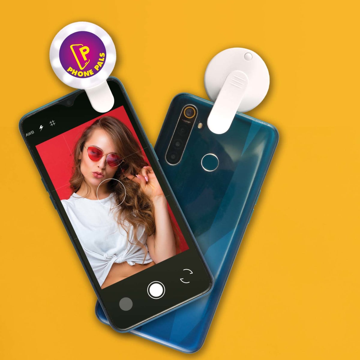 Two smartphones with lens attachments on a yellow background. The phone on the left displays a woman posing for a selfie, wearing red sunglasses and a white top. The attachment on the right phone reads Phone Pals.