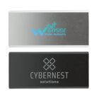 Two rectangular metallic nameplates with logos. The top plate is silver with a blue Bayside Water Authority logo featuring a wave and bar chart design. The bottom plate is black with a Cybernest Solutions logo, including geometric shapes above the text.