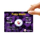 Hand holding a Fox Mobile SIM card ad with Foxy deals text, offering $40/month for 25GB and $50/month for 40GB. Includes 19GB bonus data on a 12-month SIM Only Plan. Background has purple bokeh pattern.