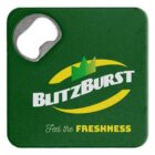 A green square bottle opener with a metal opening mechanism at the top left corner. The text BlitzBurst appears in bold white with a crown above it, and Feel the Freshness is written in yellow and white below.