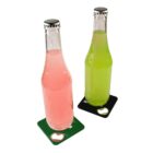 Two glass bottles with metal caps; one contains a pink liquid and the other a green liquid. They are placed on square coasters, one black and one green, each with a bottle opener design in one corner.