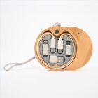 Round wooden case with a lanyard, containing multiple USB connectors and adapters in neatly organized slots. The connectors have white tips and black ports. The case is open, displaying its contents.