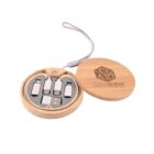A round wooden case with a lid displays a set of four USB flash drives and a connector inside. The lid, featuring the CubeQuest logo and tagline Adventure Awaits in Every Stone, is attached to a looped string.