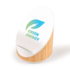 A white and bamboo-textured desk accessory features a tilted surface with a logo of a green and blue leaf containing a lightning bolt. The text Green Energy is displayed below the leaf.