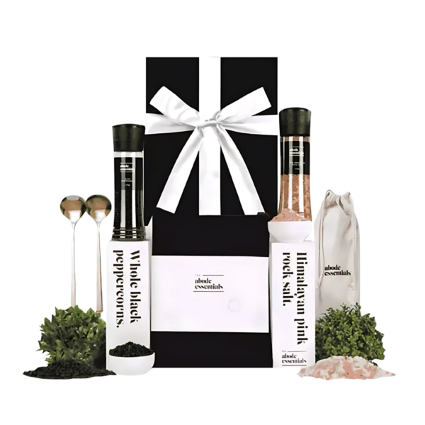 New Abode set: Gourmet salt, pepper, utensils, & decorative greenery.