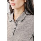 Woman in a gray collared shirt, partial view, facing right.