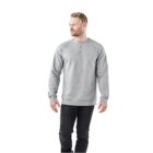 Man in a gray sweatshirt and black pants standing and looking to the side.
