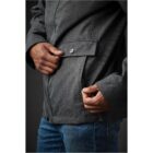 Person zipping pocket on a gray jacket.