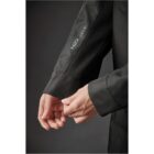Person adjusting sleeve of black H2Xtreme jacket.