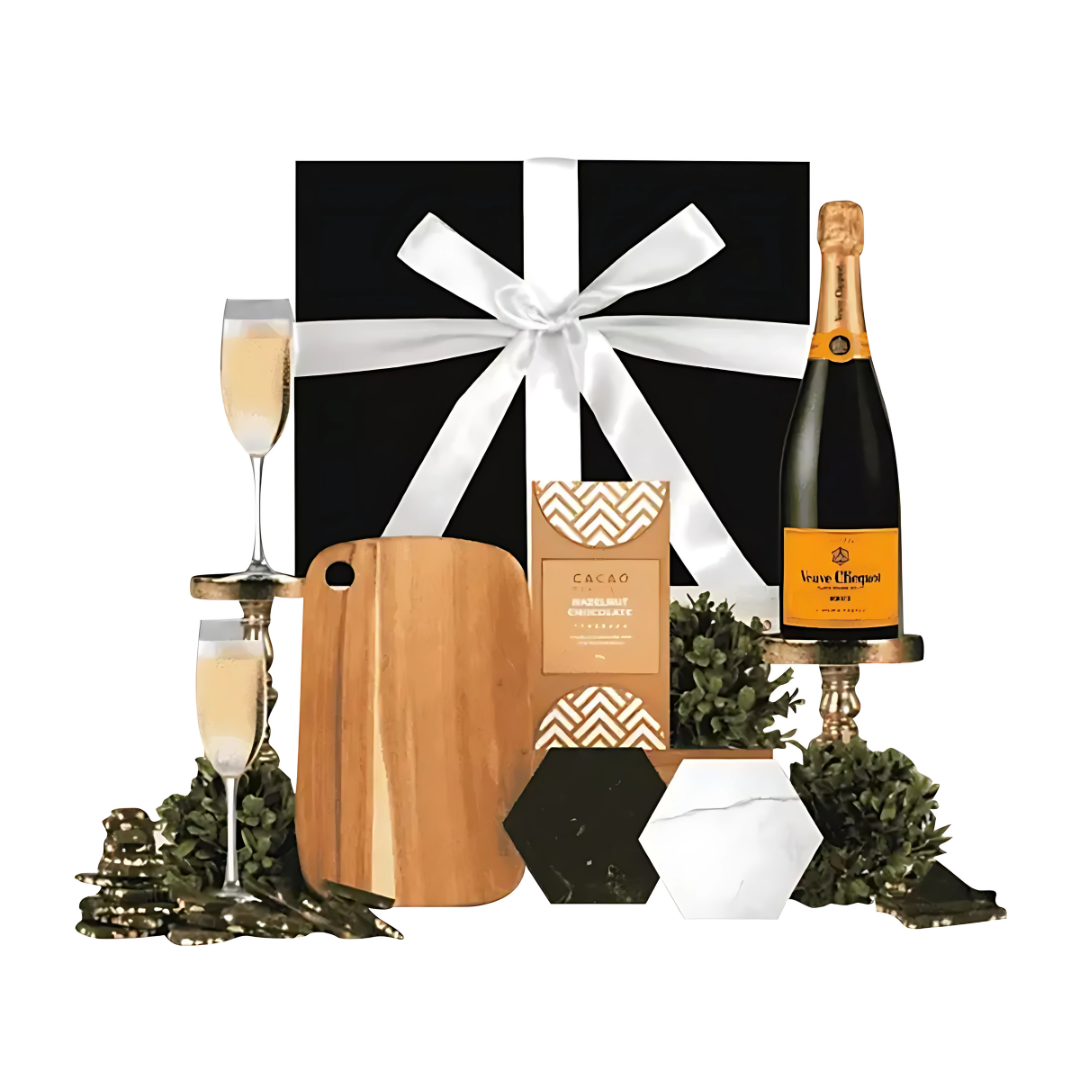 Veuve Home Champagne Gift Sets: includes champagne, glasses, chocolates, cutting board.