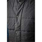 Close-up of a black quilted jacket with silver snap buttons.