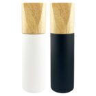 Two tall spice grinders with wooden tops labeled S and P, one white and one black.