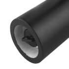 Close-up of a black cylindrical object with a hollow center and an internal cross-shaped structure.