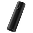 Matte black cylindrical spray bottle with a button on its side, against a white background.