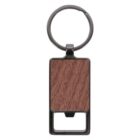 A metal keychain with a rectangular wooden inlay design, featuring a circular keyring at the top and a bottle opener at the bottom.