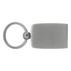 A metallic keychain featuring a rectangular, smooth, silver-tone tag attached to a circular keyring. The design is simple and modern, with an unadorned finish.