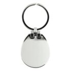 A silver keychain featuring an oval-shaped pendant. The metal is shiny and smooth, with a hinge connecting the pendant to the circular keyring. The design is simple and elegant.