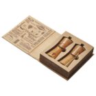 A gift set in a rustic cardboard box featuring two wooden salt and pepper grinders. The box lid has decorative text with phrases like premium quality and cheese names, enhancing its artisanal appeal.