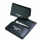 Black leather wallet with Your Logo Here text on the exterior and interior. The wallet is open, revealing a bill inside and multiple card slots.