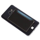 A black smartphone with a black leather cardholder attached to the back. The cardholder has white stitching along the edges.