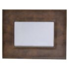 A rectangular brown leather photo frame with visible stitching around the edges and inner border, surrounding a blank space for displaying a photo. The leather has a slightly worn, vintage look.