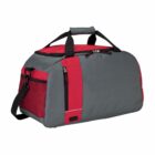 A gray and red duffel bag with black handles and a shoulder strap. It features side pockets, one with a zipper and another with a red mesh design. The zipper closure is visible on top of the bag.