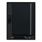 A black notebook with an elastic band, a silver and black pen, and a USB flash drive are neatly arranged in a black gift box.