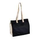 A black tote bag with beige handles and sides, empty and standing upright on a white background.