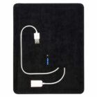 A black rectangular power bank with a white USB cable attached. The power bank has four blue LED lights indicating the charge level. The USB cable forms a loop on the dark surface.