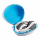 Gray and white headphones folded inside a round, open case with a bright blue interior.