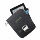 A black, eco-friendly shoulder bag with a metal buckle partially open, revealing a tablet displaying a calendar app and a smartphone showing app icons. The bag has a green ECOUPON logo.