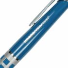 Close-up of a blue pen with silver accents. The pens clip is visible on top, and the word imagecollection is printed in white on its body. The grip area has a checkered pattern in blue and silver.